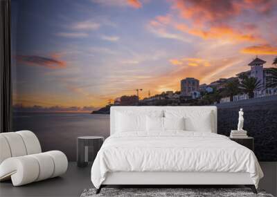 Sunrise on Reis Magos beach. Canico, Madeira, Portugal. October 2021. Long exposure picture Wall mural