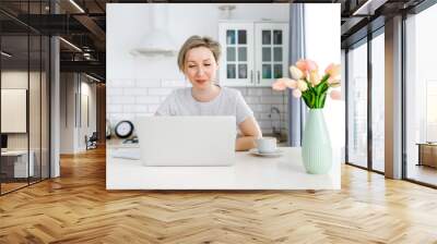 woman working on laptop Wall mural