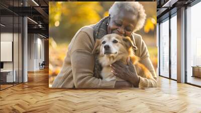 black elderly woman cuddeling with her dog Wall mural