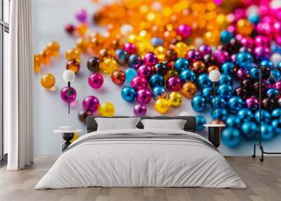 Scattering of colorful catalyst beads creating a vibrant and abstract pattern on a clean white background Wall mural