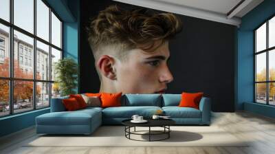 Trendy modern fade haircut for young men with stylish side view, showcasing the fashionable and textured hairstyling at the barber shop for personal grooming and care Wall mural