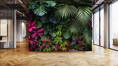 Vibrant and textured background showing a variety of green and pink jungle foliage Wall mural