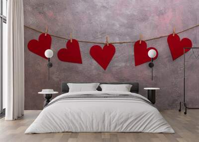 red hearts hanging on a rope Wall mural