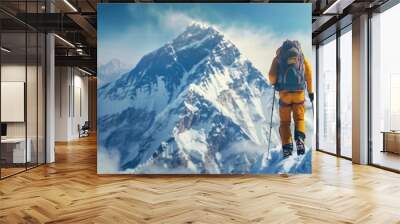 climber in protective gear ascending snowy mountain peak under clear blue sky Wall mural