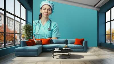 Confident healthcare professional with stethoscope, arms crossed Wall mural