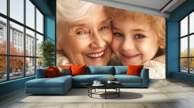 Elderly woman and young child embrace happily together Wall mural