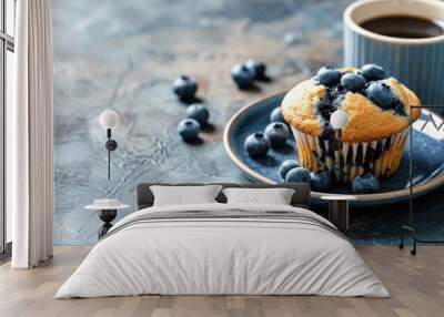 Fresh blueberry muffin on plate with hot coffee Wall mural