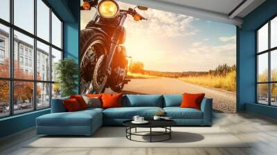 Motorcycle on open road at sunset, scenic landscape Wall mural