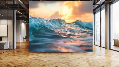 Ocean waves at sunset with orange and teal hues Wall mural