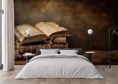 Stack of ancient books with weathered pages on a rustic table Wall mural