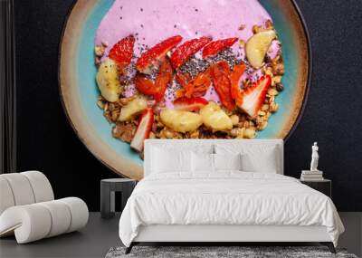 Bowl with berry smoothie, granola, chia seeds, banana, nuts, strawberries Wall mural