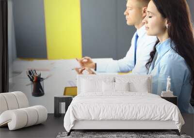 Employees in office sit at table and meditate. Workers overwork and energy recovery concept Wall mural