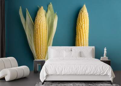 Two cobs of corn at blue background Wall mural