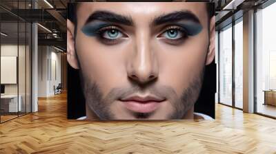 Close-up portrait of a young man with stylish make-up. Wall mural