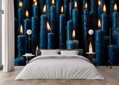 blue candles on a dark background Wall mural