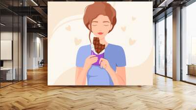 A woman eats a chocolate bar. Cartoon design.
 Wall mural