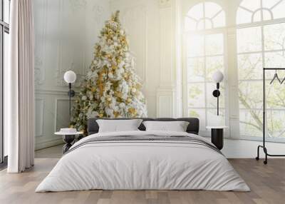 Classic christmas New Year decorated interior room New year tree. Christmas tree with gold decorations. Modern white classical style interior design apartment, large window. Christmas eve at home Wall mural