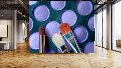 Eyeshadow palette and make up brush colored in trendy color of year 2022 Very Peri background. Flat lay top view copy space. Inspired by using color 17-3938. Color of the year concept Wall mural