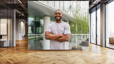 Happy african american man smiling outdoor. Portrait of young happy man on street in city. Cheerful joyful handsome person guy looking at camera. Freedom happiness carefree happy people concept Wall mural