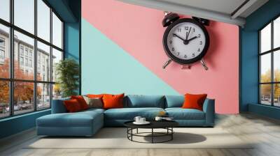 Ringing twin bell vintage classic alarm clock on blue pink pastel colorful trendy geometric background. Rest hours time of life good morning night wake up awake concept. Flat lay top view copy space Wall mural