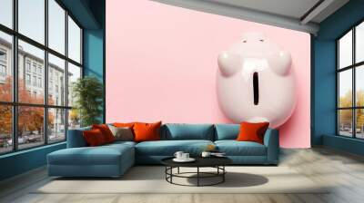 Saving investment budget wealth retirement financial money banking concept. Pink piggy bank isolated on pink pastel colourful trendy background. Flat lay top view copy space Wall mural