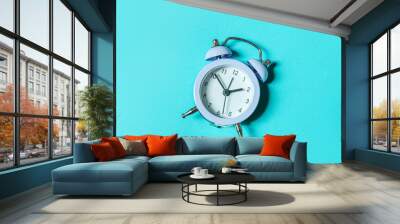 Simply minimal design ringing twin bell vintage classic alarm clock Isolated on blue pastel background. Rest hours time of life good morning night wake up awake concept. Flat lay top view, copy space Wall mural