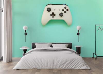 White joystick gamepad, game console on blue colourful trendy modern fashion pin-up background. Computer gaming competition videogame control confrontation concept Wall mural