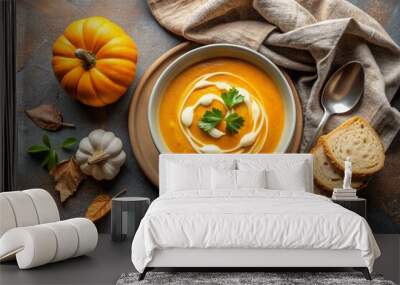 A seasonal autumn dish. Traditional delicate pumpkin cream soup puree with cream and pumpkin seeds on a brown beige background. Wall mural