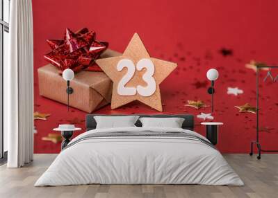 Greeting card for the Defender of the Fatherland Day. White, gold, red stars, a gift box and the number 23 on a red background. The holiday is February 23. Wall mural