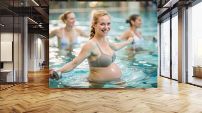 Pregnant, beautiful woman, in the pool for group aqua aerobics classes. The concept of pregnancy, childbirth and parenthood. Healthy lifestyle. Wall mural