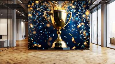 Reward.A gold cup and flying confetti on a dark blue background. Sports competitions, success, business, the concept of achievement and victory. Wall mural