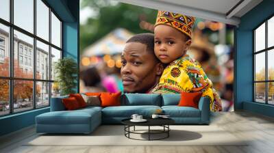 portrait of a young child sitting on his father's shoulders at a Juneteenth festival, both wearing traditional African garments, vibrant colors and joyful expressions Wall mural