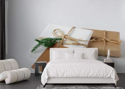 Christmas gifts on a light background in a light package. Copy space.  Wall mural