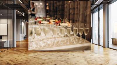 glasses of champagne at a wedding festive buffet Wall mural