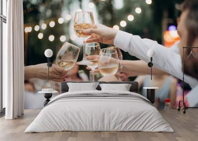 people with glasses of alcohol at a banquet Wall mural