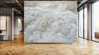 close up of a white knitted fabric, detail of a marble, fabric flowers, lace Wall mural