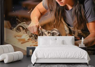 A carpenter girl on a workbench processes a wooden blank. Wall mural