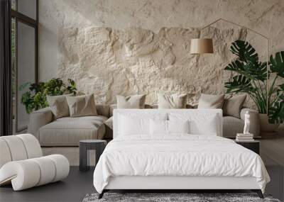 A cozy living room with a comfortable couch and plants arranged by a stone wall Wall mural