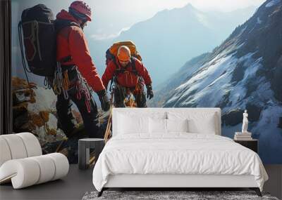 Climbers with equipment climb the mountains. Wall mural