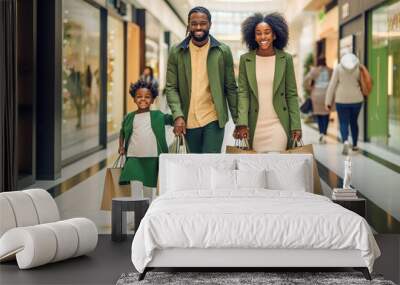 Happy African American family in a store with purchases. Family in green clothes. Wall mural