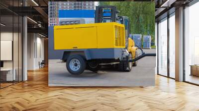 Transportation of heavy mobile compressors by special equipment Wall mural