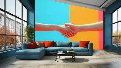 Two people exchange a handshake against an electric blue backdrop Wall mural