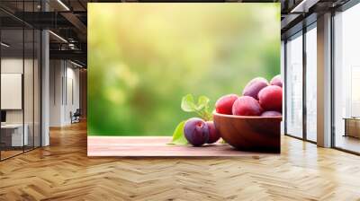 Harvest plums in a bowl. Selective focus. Wall mural