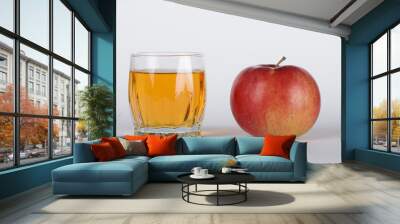 Apple with glass of juice  Wall mural