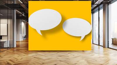 White paper in speech bubble shape set against yellow background. Wall mural