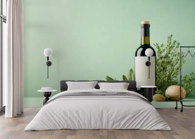 Elegant wine bottle with fresh herbs and olives on green backdrop Wall mural