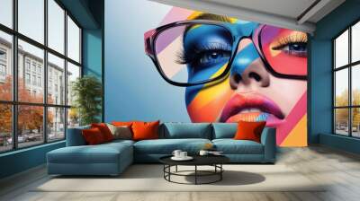 A woman with colorful makeup and bold eyeglasses stares intensely at the camera. The background is a vibrant abstract design. Wall mural