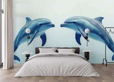 Two playful dolphins swim gracefully together in clear blue water, showcasing their intelligence and social behavior. Wall mural