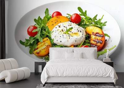 A fresh salad featuring grilled peaches, cherry tomatoes, and arugula topped with a poached egg, on a white plate against a bright background. Wall mural