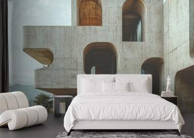 A brutalist structure made of raw concrete, featuring bold, monolithic forms and a minimalist aesthetic Wall mural